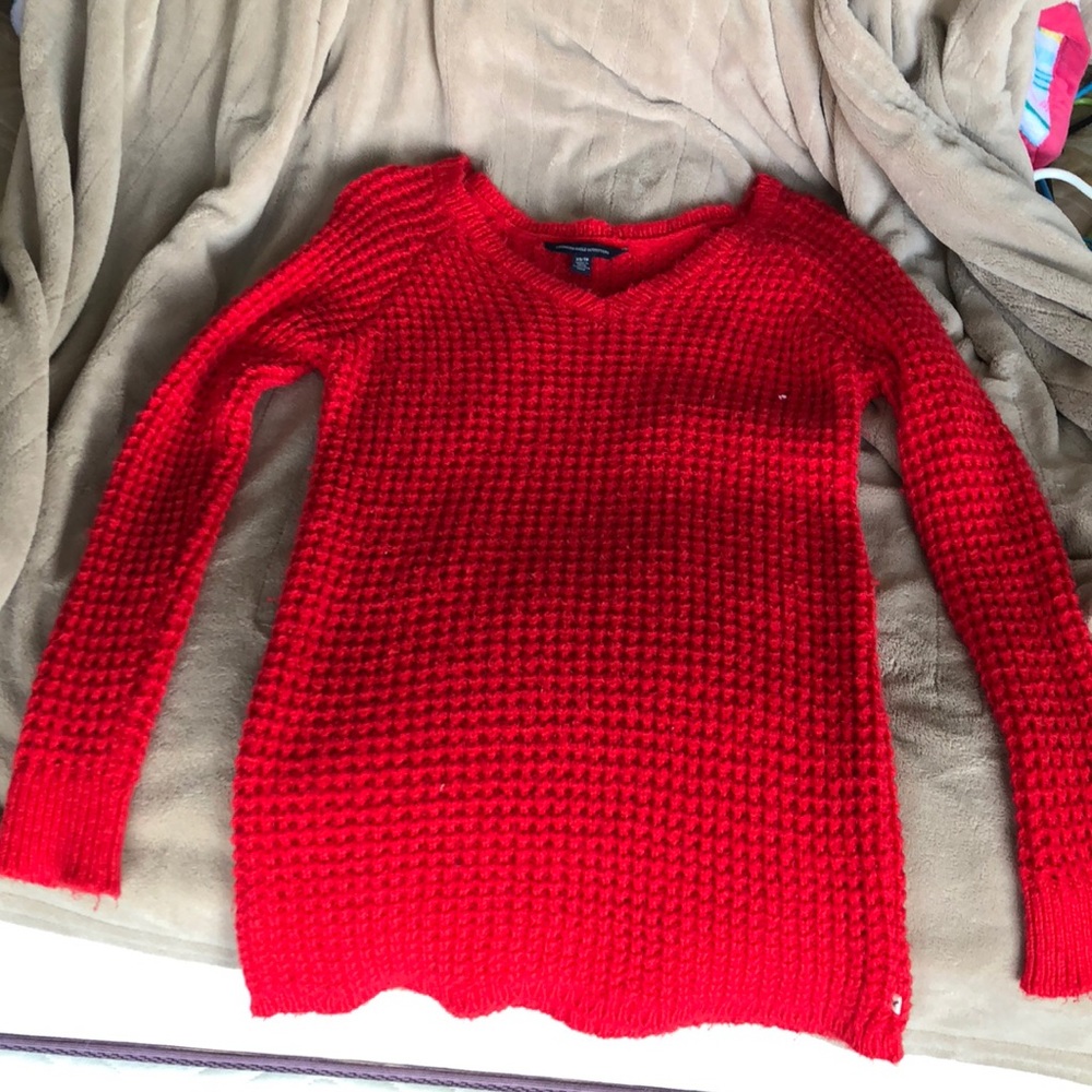 Red cable knit sweater